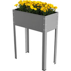 Metal Raised Garden Planter – A stylish gray metal raised garden planter with four sturdy legs, filled with vibrant yellow flowers. The planter features a sleek, modern design with visible rivets securing the corners, offering an ergonomic solution for growing plants in small spaces or elevated settings.
