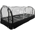 "Portable greenhouse with a transparent plastic cover, zippered sides, and a metal shelving unit inside. The structure is designed for plant propagation and protection."
