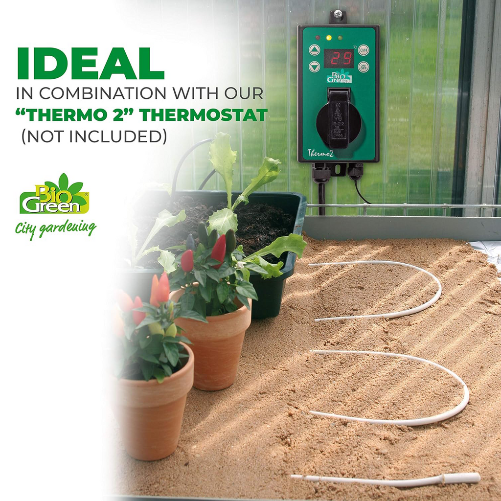 The image shows a flexible heating cable laid across the soil in a greenhouse with potted plants on top. The cable is connected to a "THERMO 2" thermostat (which is not included in the image) and is ideal for use with it to regulate the soil temperature for plant growth. The image emphasizes that the thermostat is not included with the heating cable.