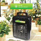 Biogreen Tropic 2kW portable heater in a greenhouse setting, surrounded by plants, with a splash-proof IPX4 rating badge visible, designed for heating in damp environments like greenhouses.