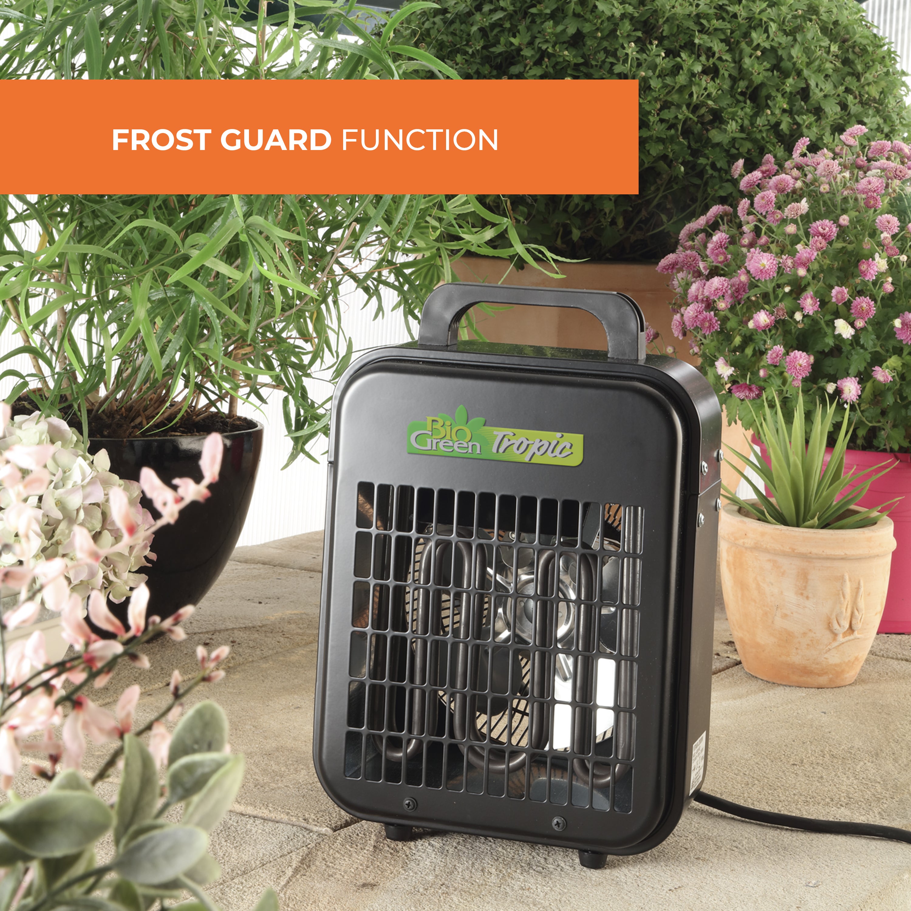 Biogreen Tropic 2kW heater with Frost Guard function, placed amidst potted plants in a well-lit indoor setting, providing gentle warmth to protect plants from frost.